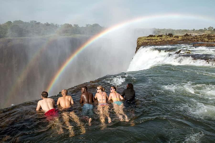 From Victoria Falls: Livingstone Island Tour & Devils Pool - Getting to Livingstone Island: Minibus, Briefing, and That First Spray