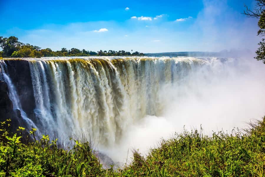 From Victoria Falls: Livingstone Island Tour & Devils Pool - Standing at the Basalt Edge: What the Main Falls View Does to Your Brain